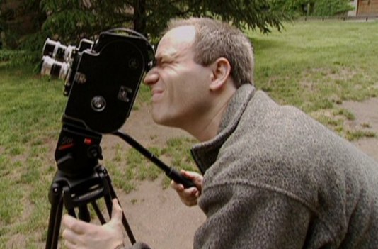 Nathaniel Kahn recording his Fathers Buildings with a Bolex in the film My Architect