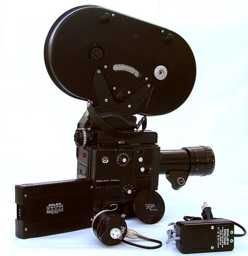Bolex EL Surrounded by Battery, WM Mag motor, and Charger